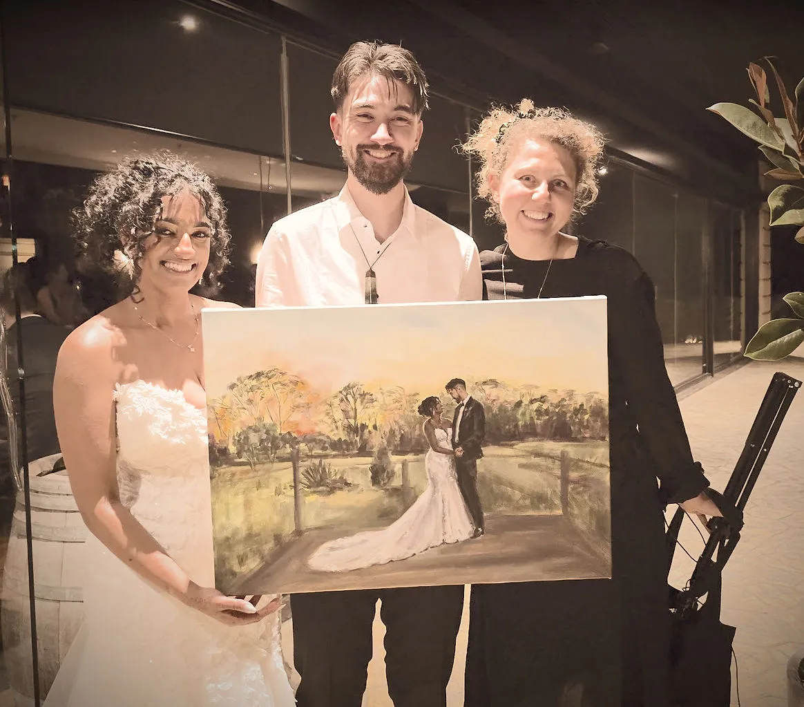 Couple with Olga revealing their painting