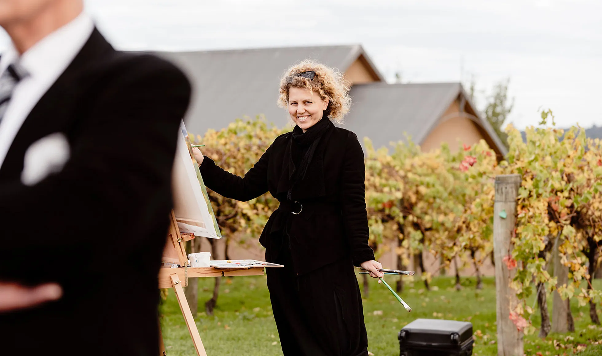 Olga painting live at a vineyard wedding
